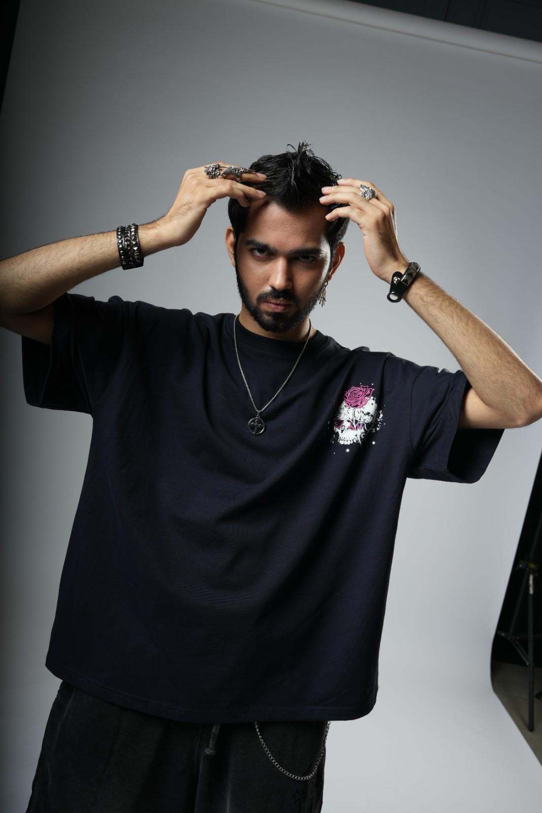 Man adjusting his hair  gray background