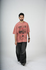 Man wearing a red t-shirt with graphic design on a white background