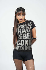 Woman wearing a black graphic t-shirt with text on a white background