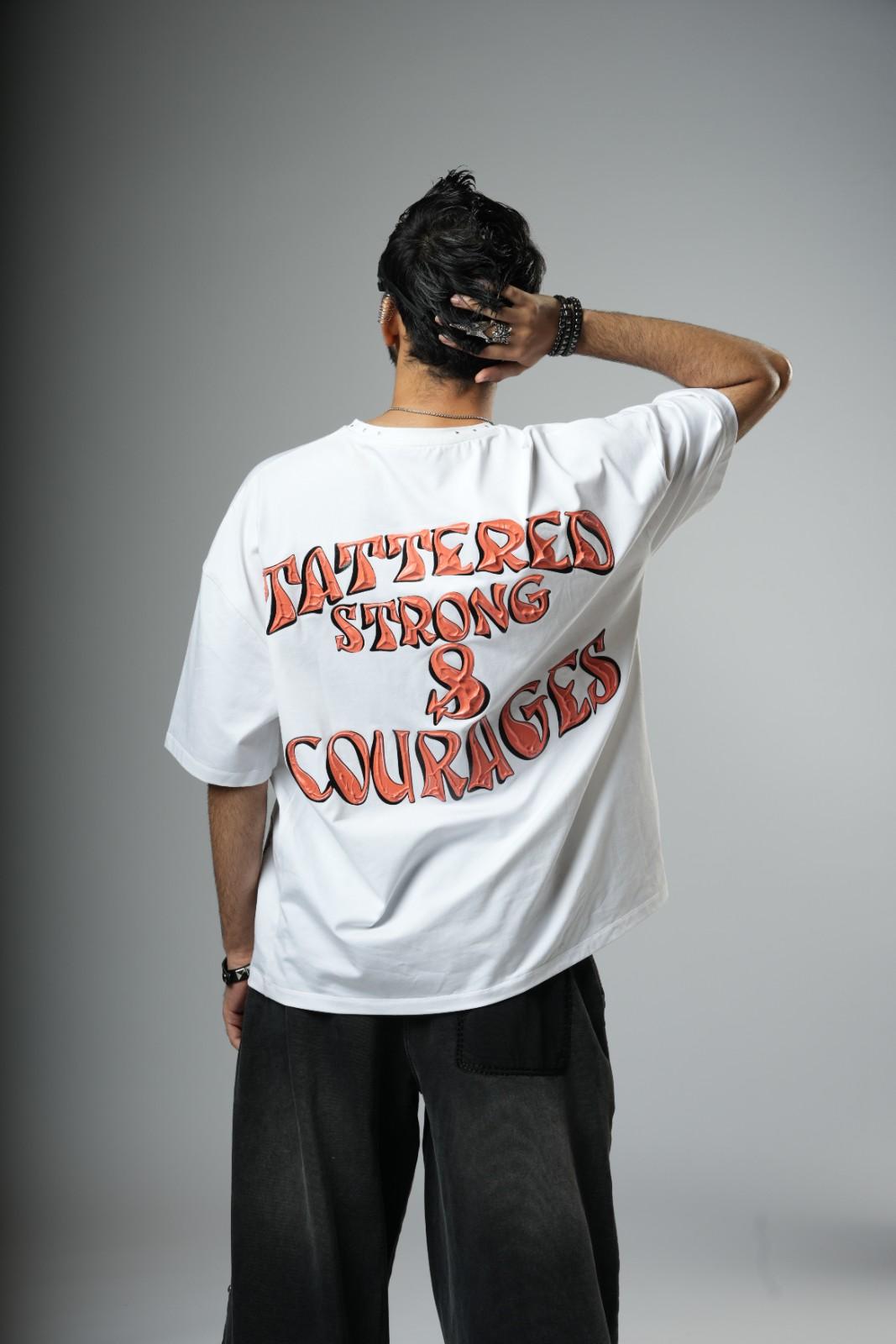 Person wearing a white t-shirt with red text on the back