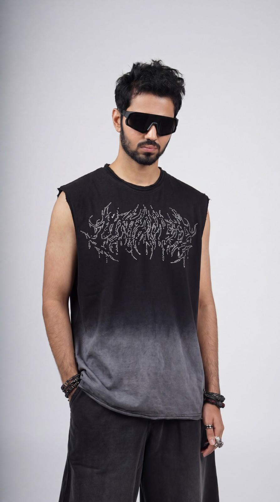 Man wearing a black sleeveless shirt with white text design on a gray background