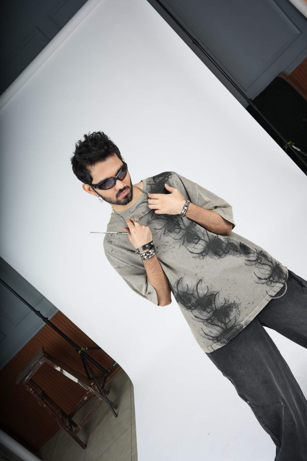 Man posing with a product on a white background
